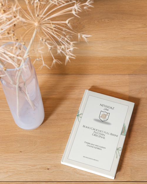 Nevadazboho pattern book on a wooden surface with dried plants in the background