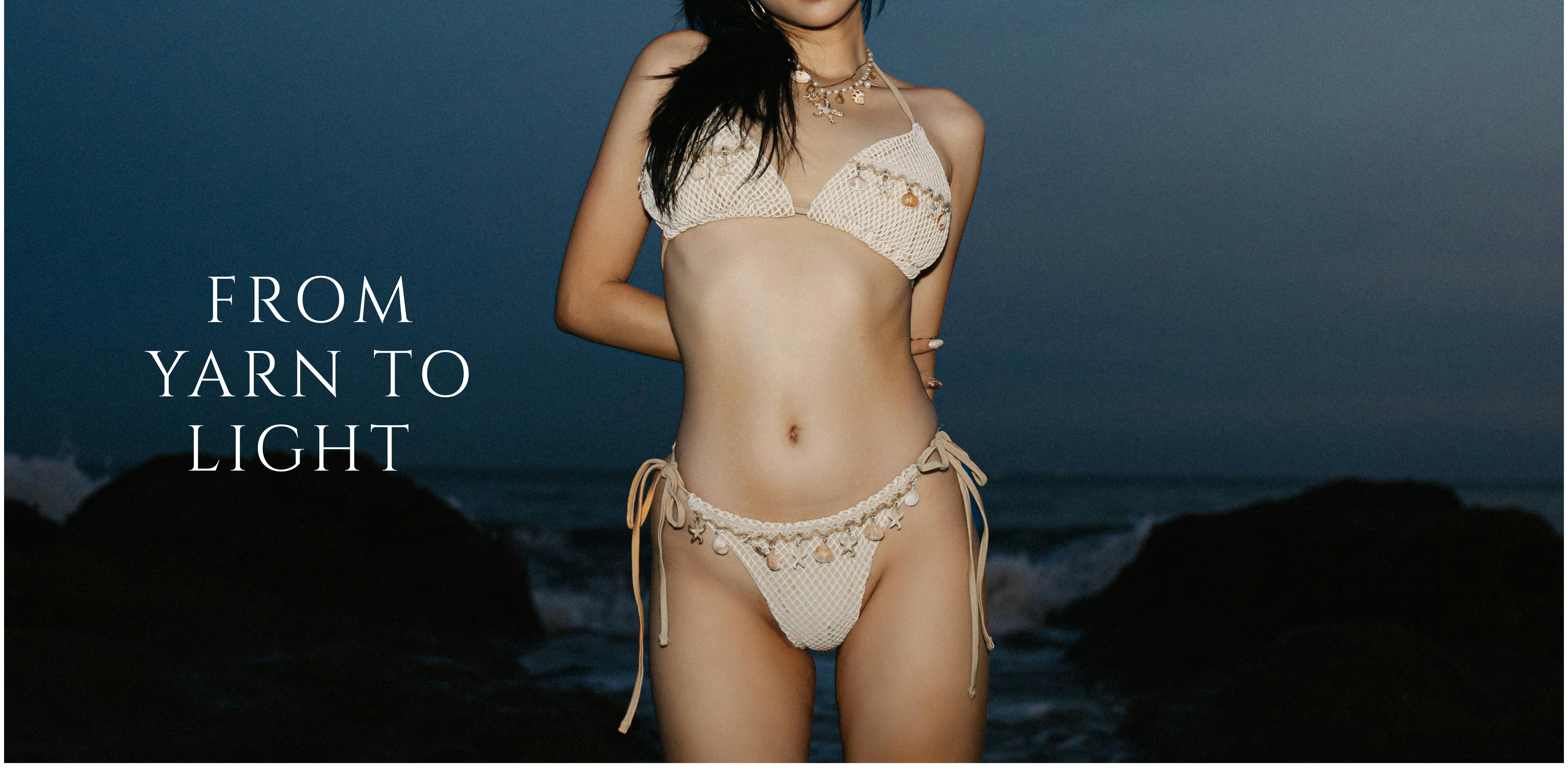 Woman in a beige bikini with text 'From Yarn to Light' against a dark ocean background