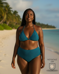 Woman wearing a teal bikini on a beach with palm trees and clear water.