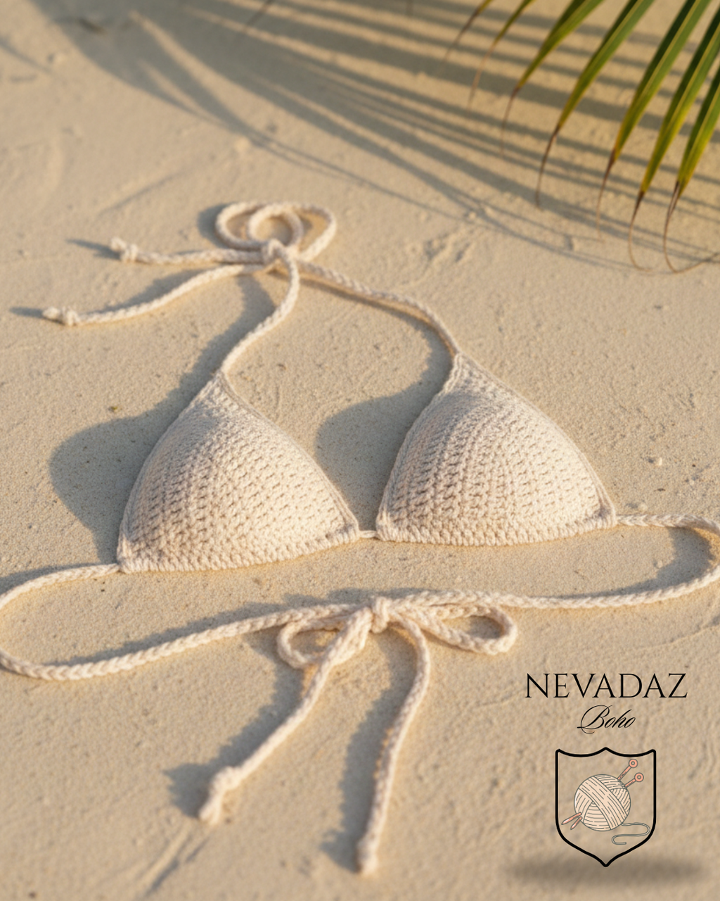 Beige top bikini lying on sand with palm leaf shadow, NEVADAZ brand visible